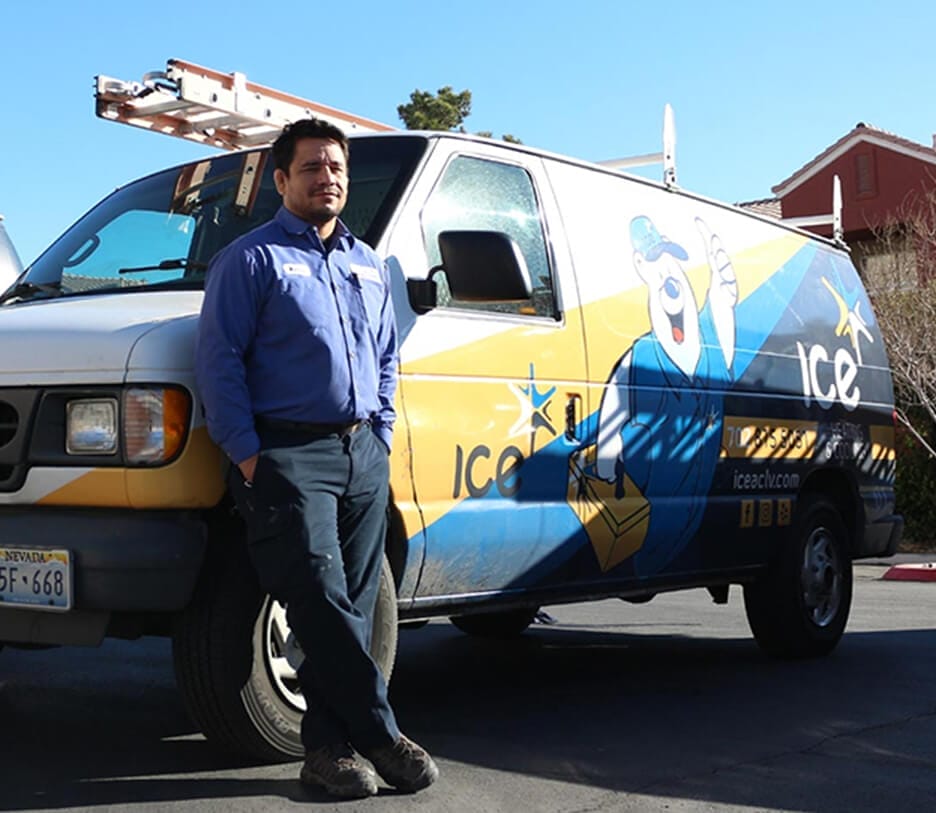 Man standing near ICE Heating Cooling and Plumbing van