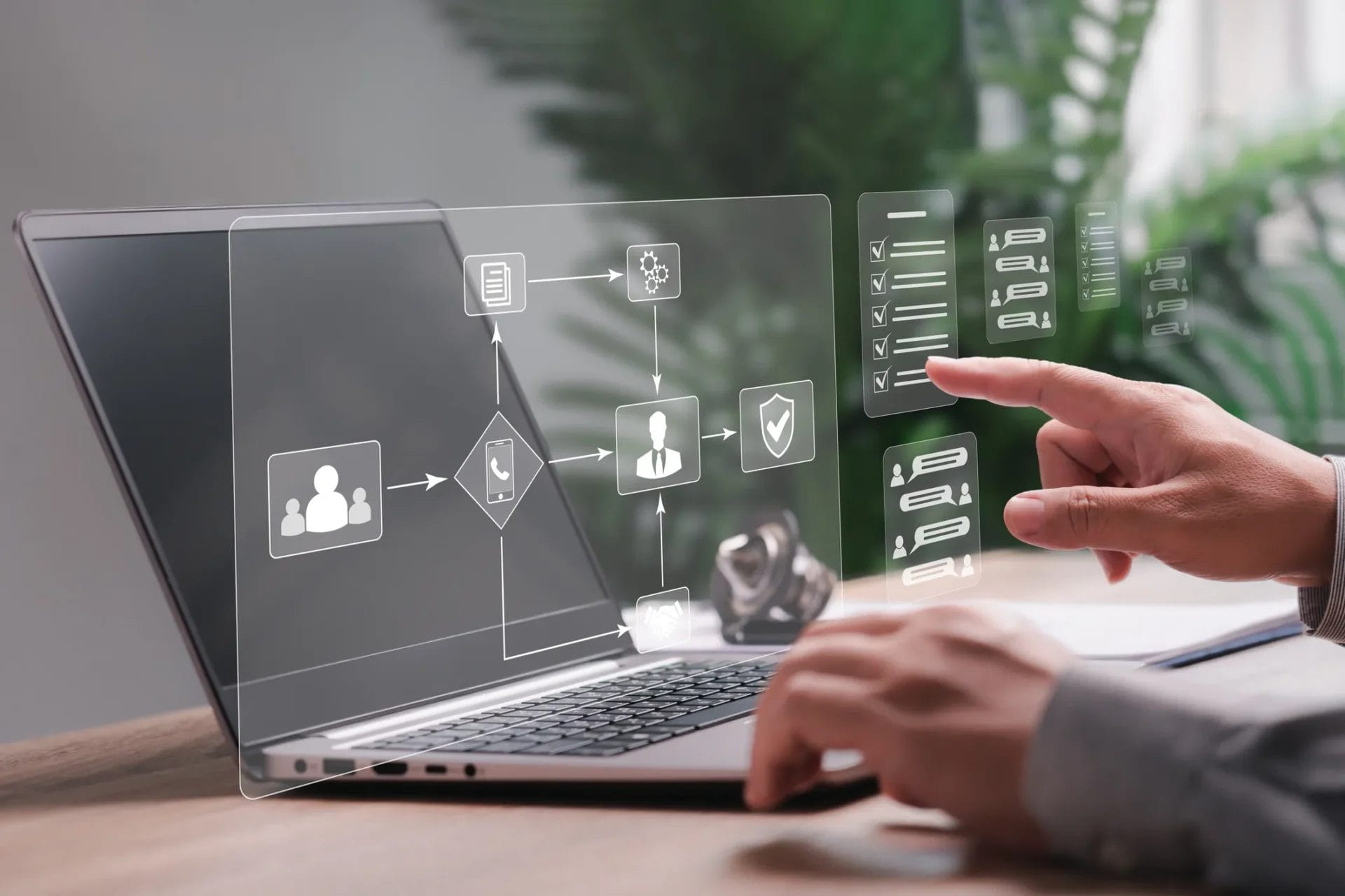 a businessman utilizing a laptop to manage customer communications and visualize processes through a business flow chart system