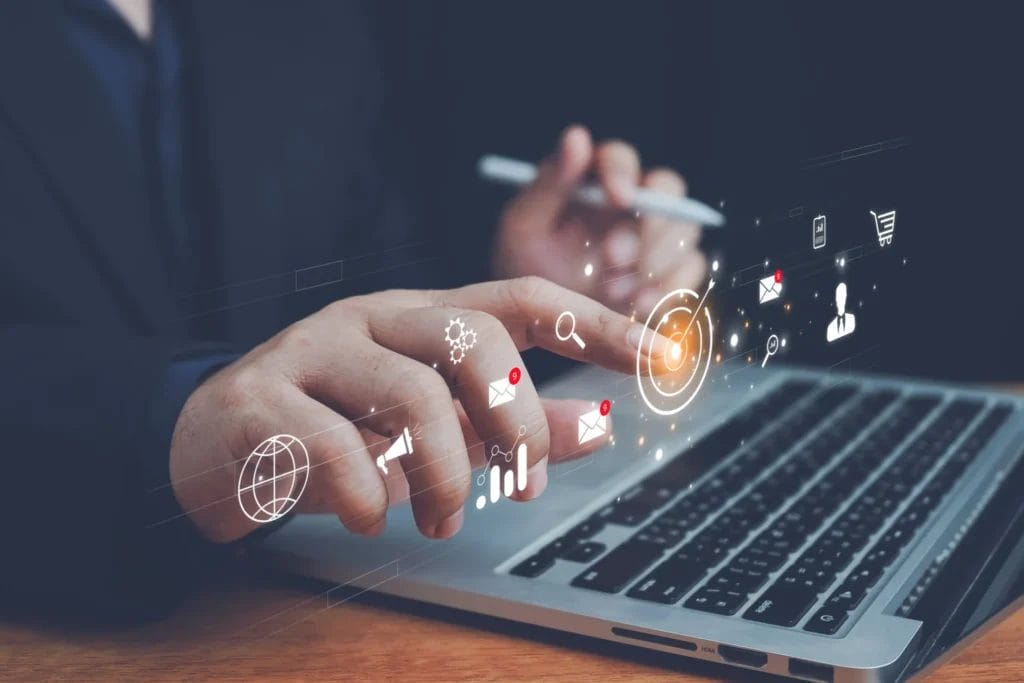 businessman sitting at a desk using a computer, with a glowing digital network of icons floating in front of him the symbols includchat bubbles, email envelopes, phone icons, shopping carts, and others visually representing lead conversion rate improvement