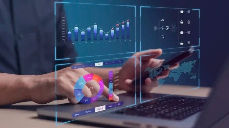 Businessman using a laptop and smartphone with virtual data dashboards displaying kpis, charts, and business analytics visuals, representing modern the us of a lead tracker management software