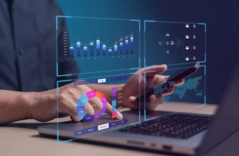 businessman using a laptop and smartphone with virtual data dashboards displaying kpis, charts, and business analytics visuals, representing modern the us of a lead tracker management software